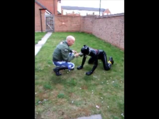 Skinhead playing with his rubber pup