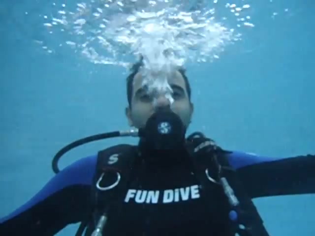 Barefaced scubadiver breathing underwater - video 2