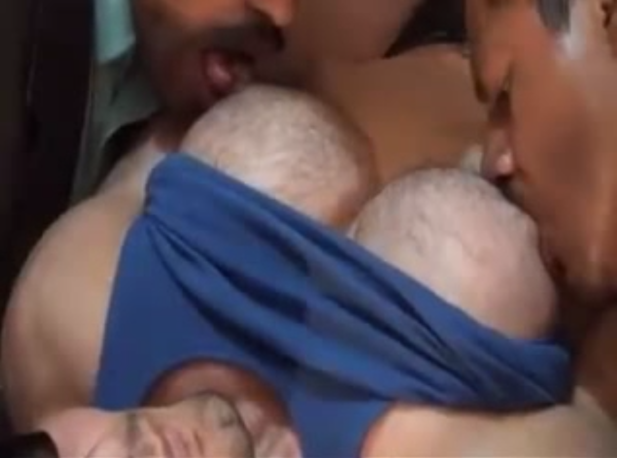 Sucking on a huge muscle chest
