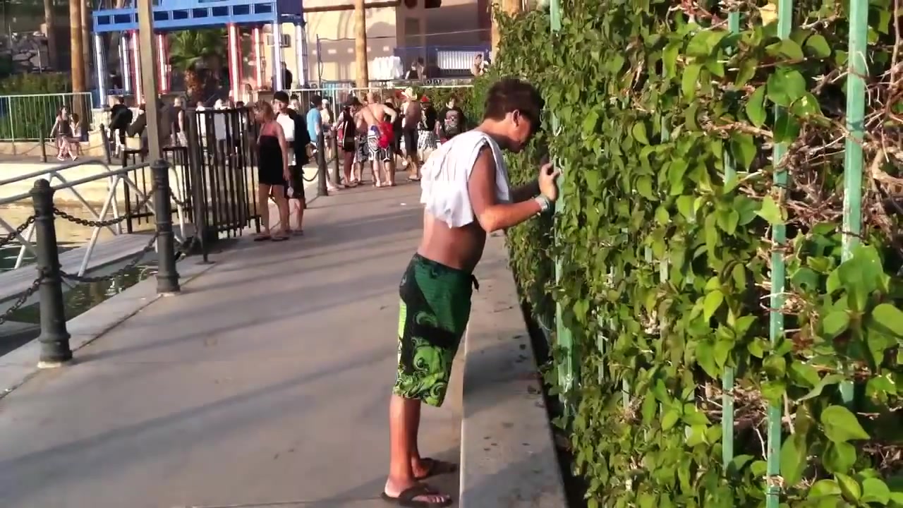 shirtless dude pukes in public