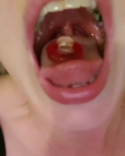 girl open mouth gummy swallow