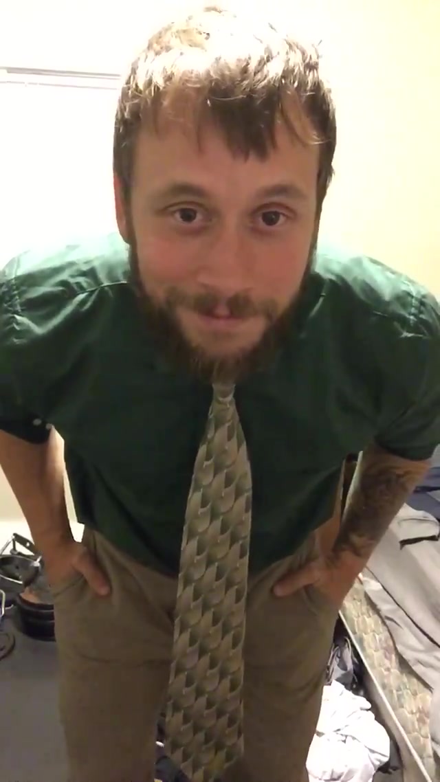 car salesman hides big boner with a tie