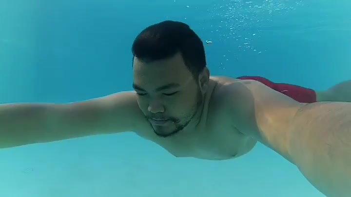 Underwater swimming in hotel pool
