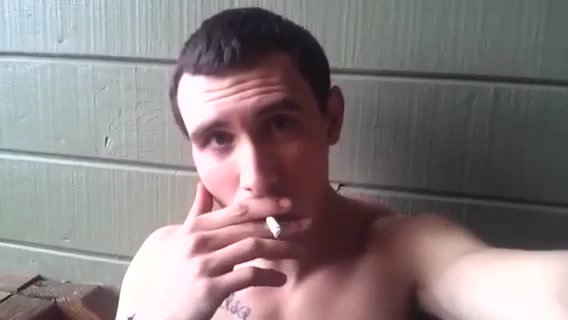 Jock smoker shows off chest while smoking Marlboro