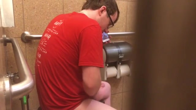 Nerd with a big cock strokes in the stall - spy vid