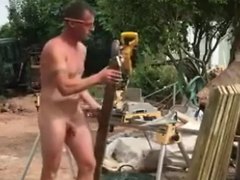 Beefy hung builder working naked on the job site