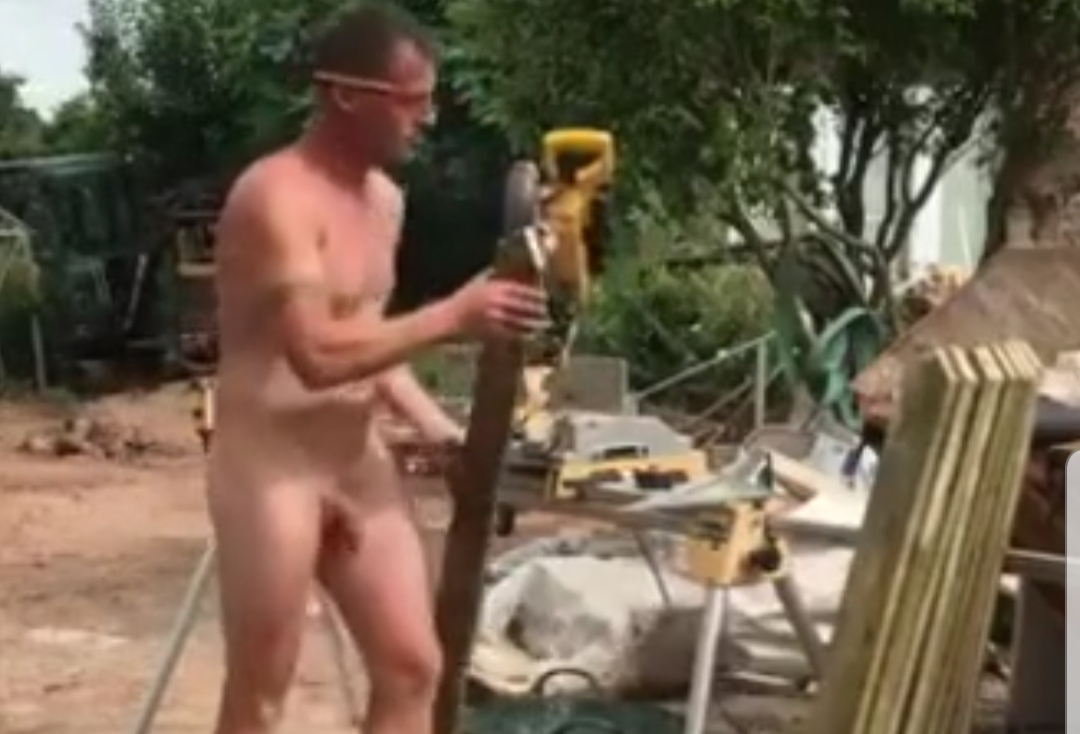 Beefy hung builder working naked on the job site