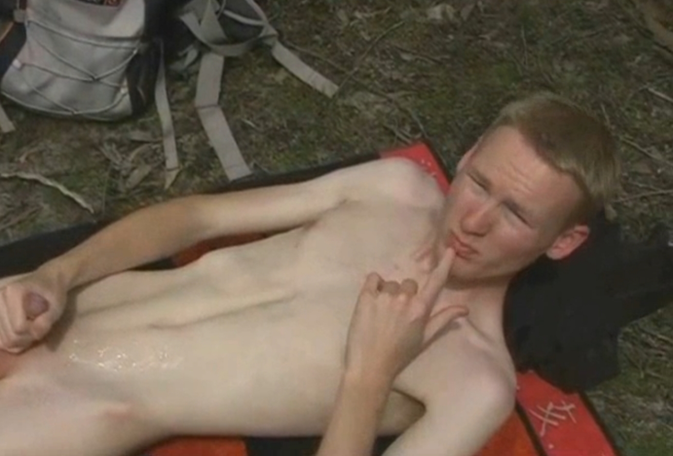 Smooth nordic blond guy jerks in public and licks up his cum