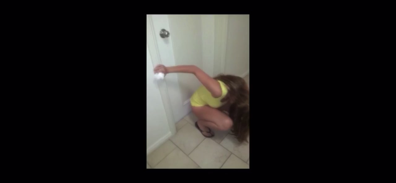 Girl peeing on hotel tiled floor
