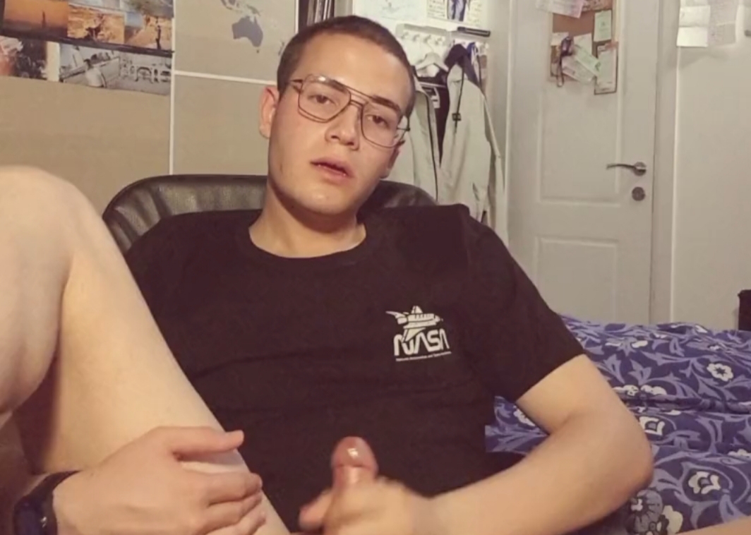 Nerdy college guy playing with his hole