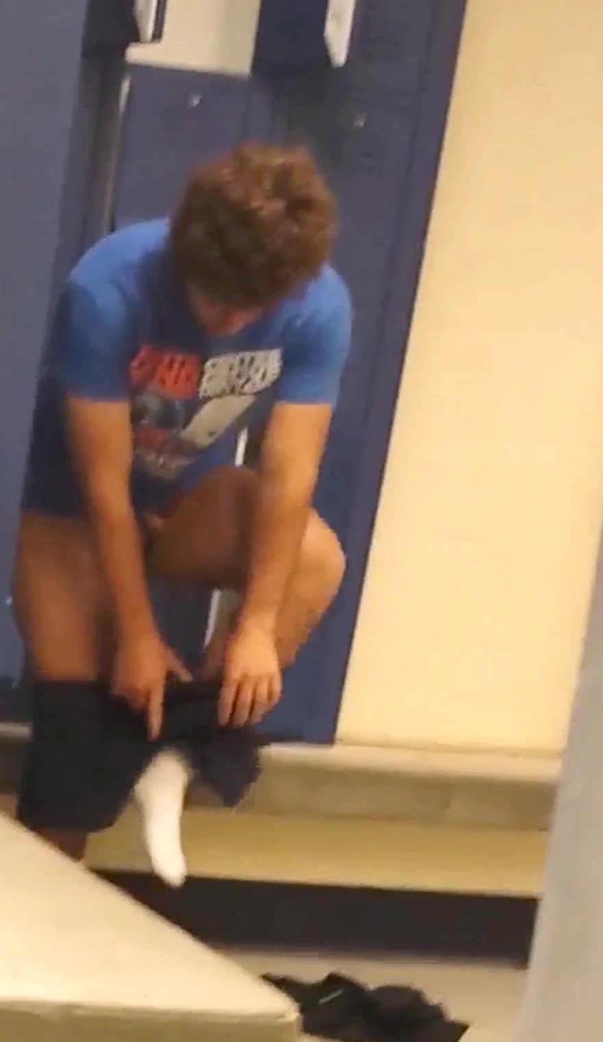 Young muscular guy bottomless in the locker room