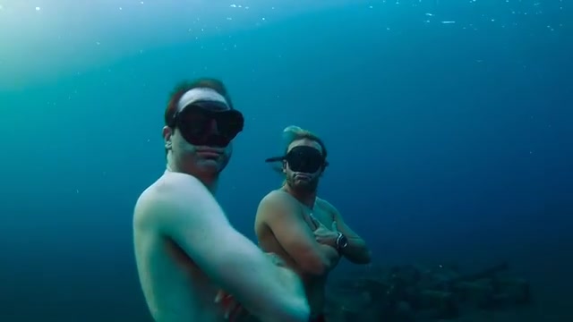 Hot freedivers breatholding underwater