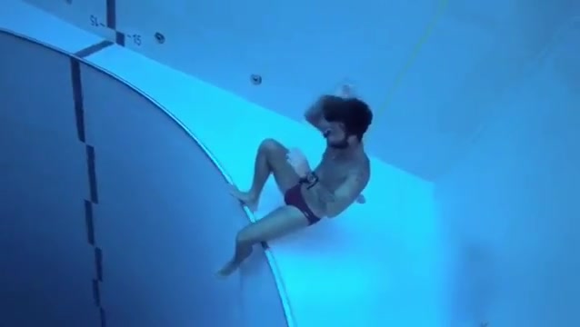 Breatholding underwater in bulging speedos