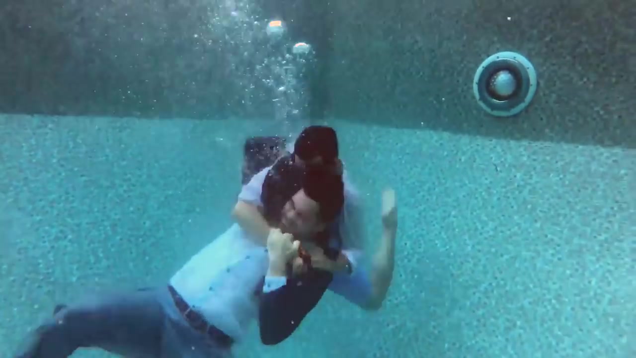 Fully clothed underwater fight