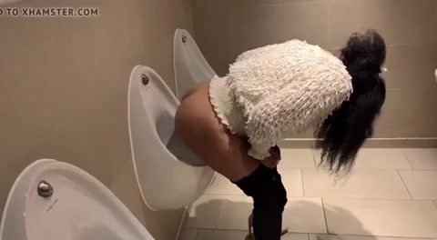 Mixed Chick Pees In Men’s Room