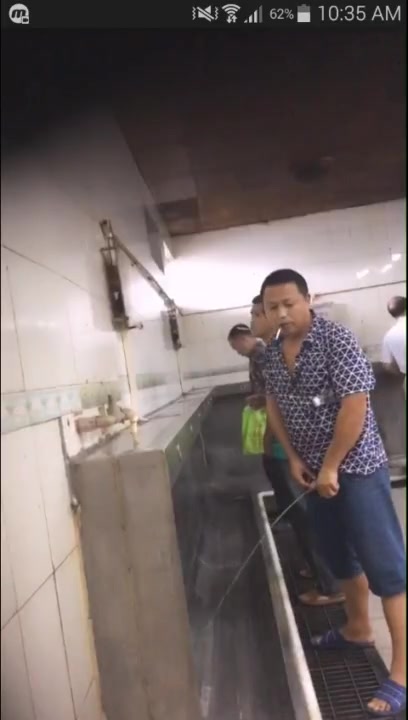 ASIAN DADDY PISSING AT URINAL