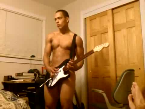 Naked dude jammin out