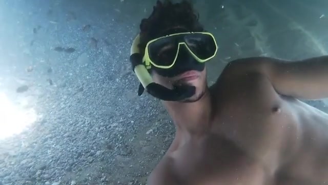 Barechest fit freediver breatholding underwater