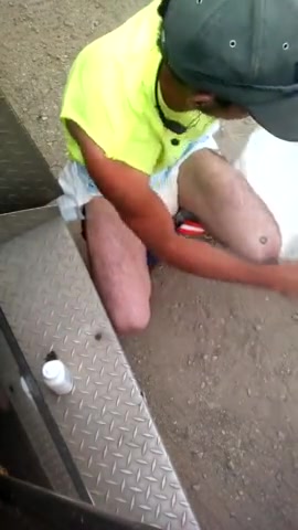Country guy changes diaper at work