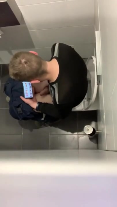 spy a boy play in toilet