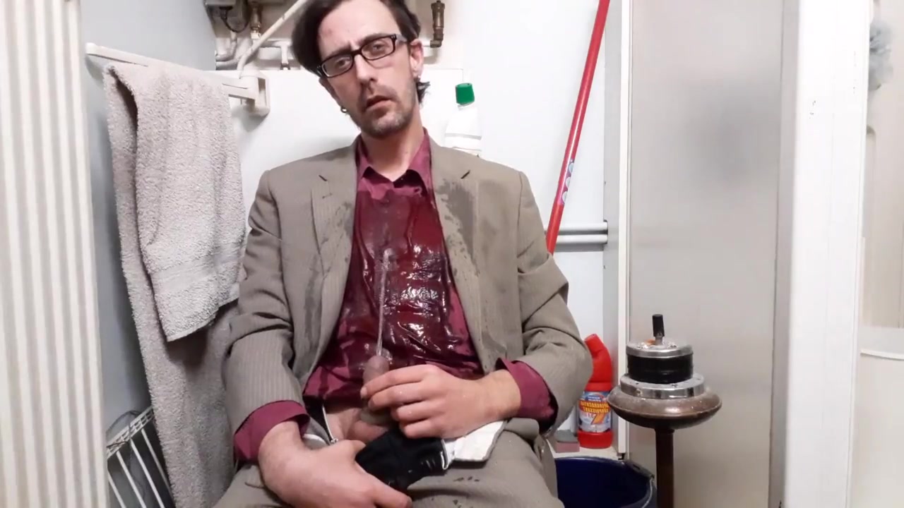 Nerdy hot piss pig soaks in his suit