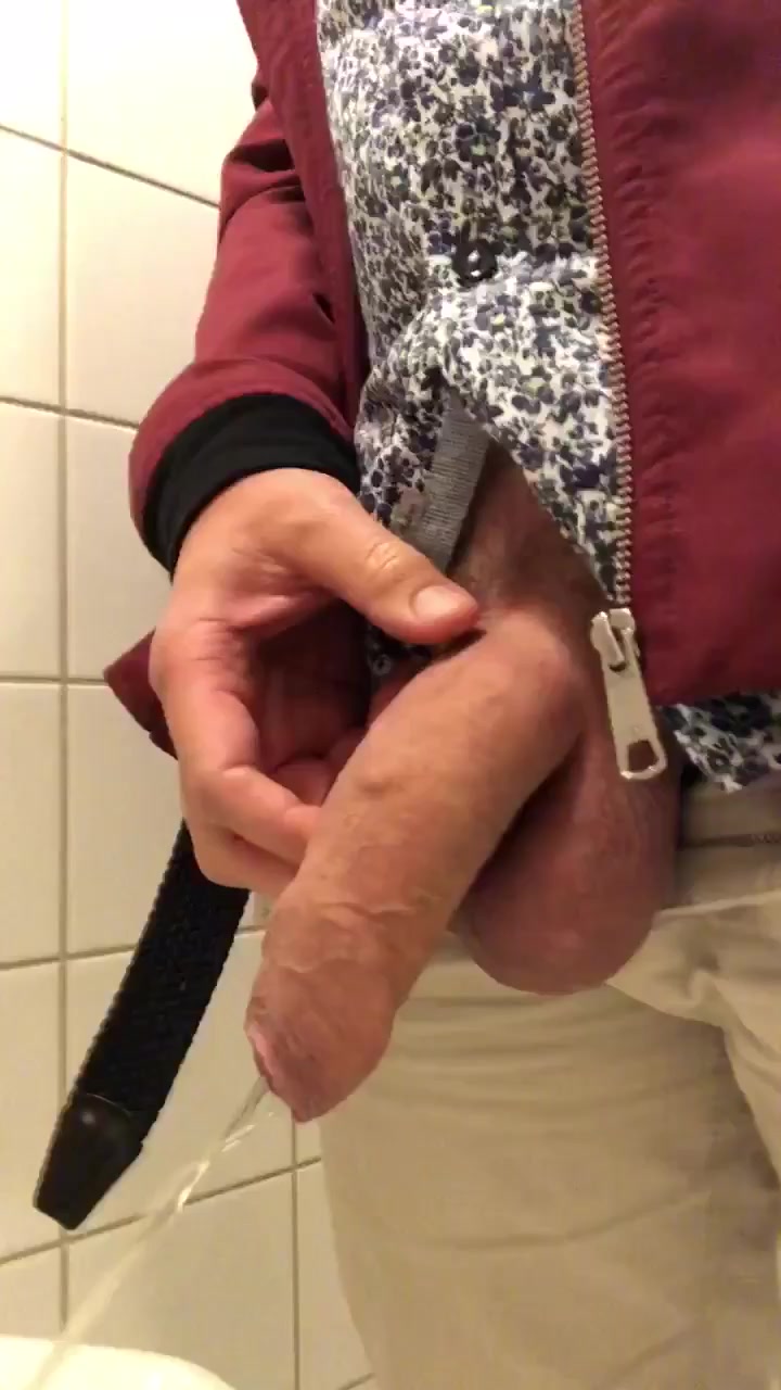 Hung guy getting hard while pissing