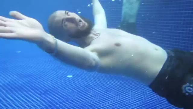 Turkish buddies goofing barefaced underwater