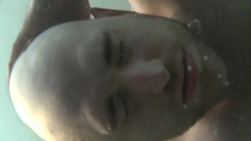 Bald guy breathold and start drowning underwater