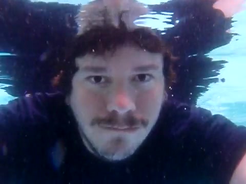 Bearded barefaced man breatholding underwater again