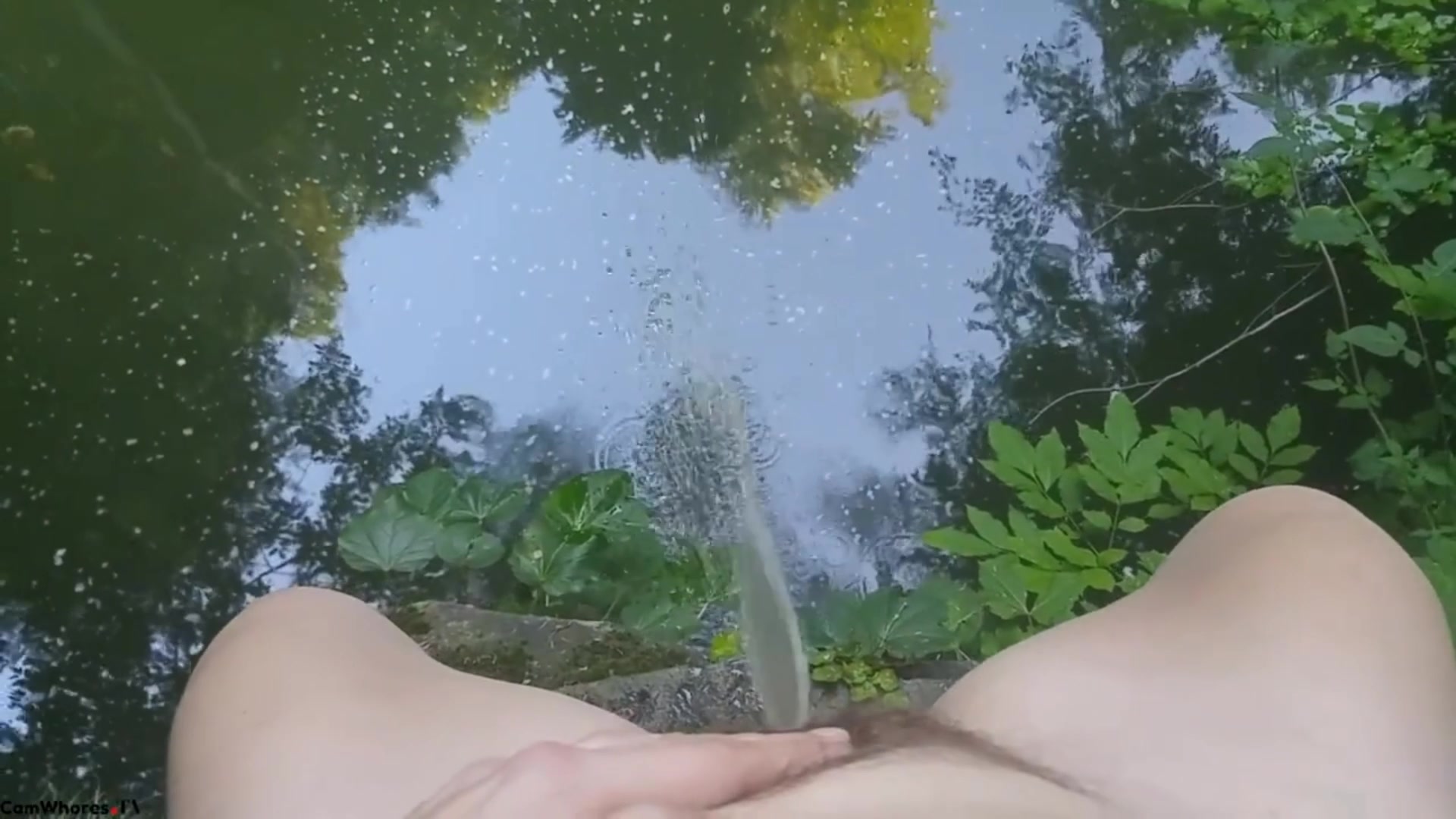 Girl Peeing into lake