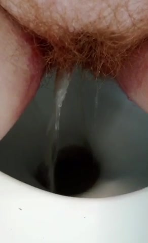 Hairy Redhead Peeing During Her Period