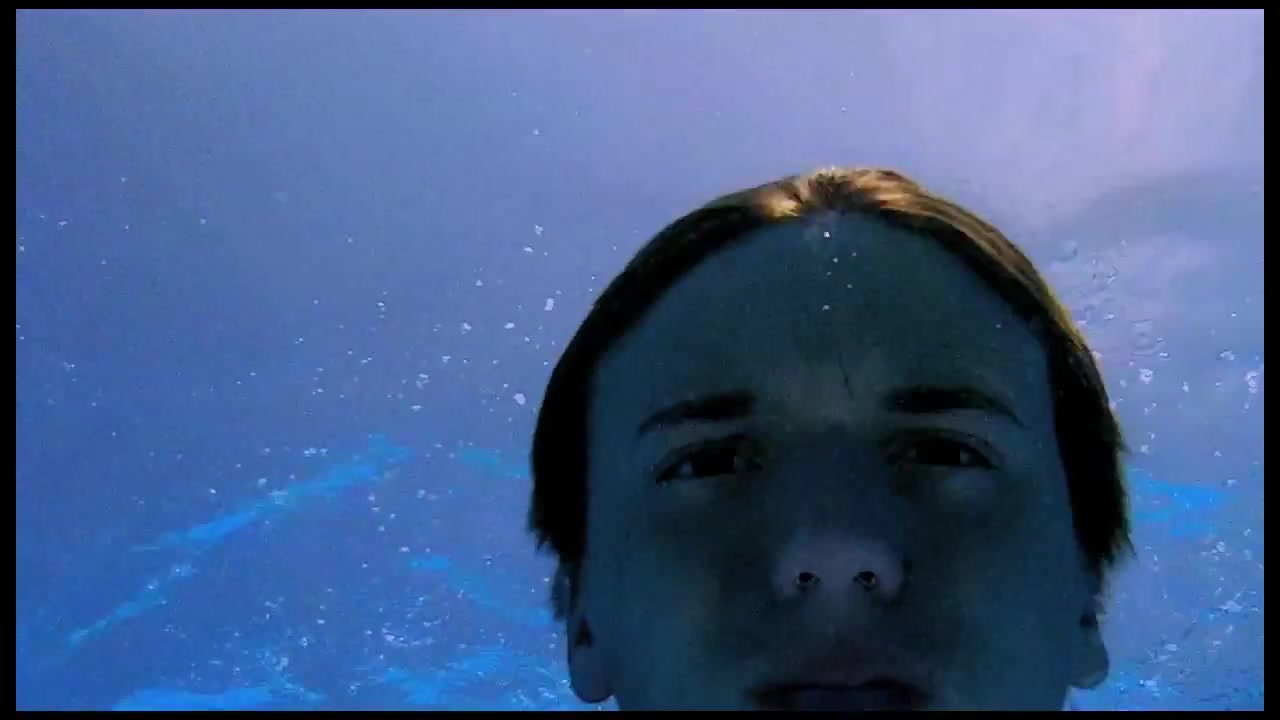 Barefaced cutie breatholding underwater in pool