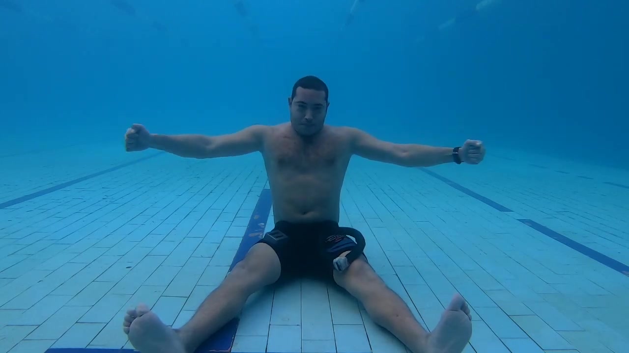Arab cutie stretching barefaced underwater