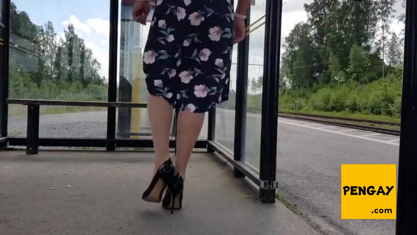 HannaTransa Chastity Crossdresser outdoors at train station.