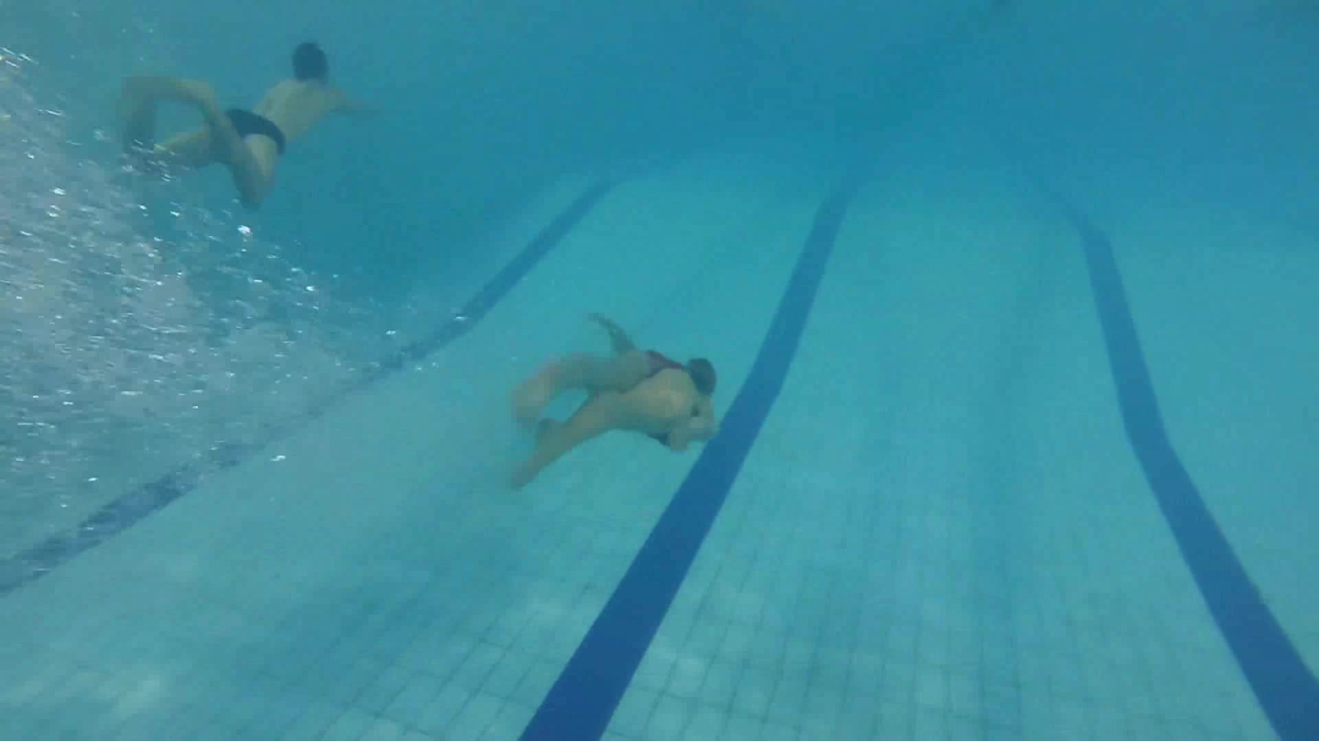 Cute swimers breatholding barefaced underwater