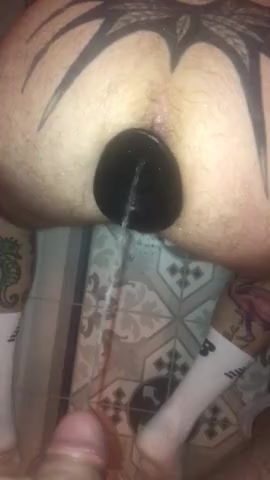 Inked pig filled with piss