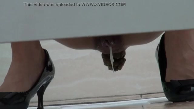Sexy woman drops her jizz and a big turd in a public toilet!