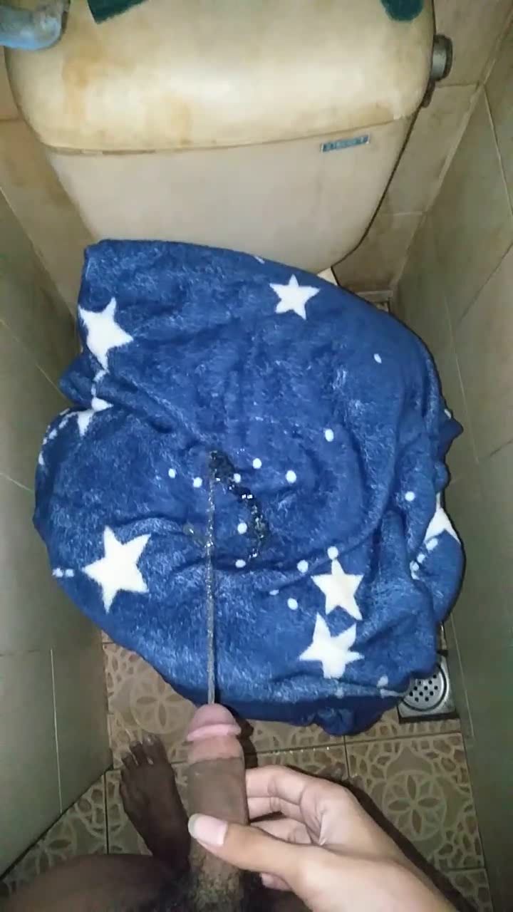 Pissing on soft blue blanket