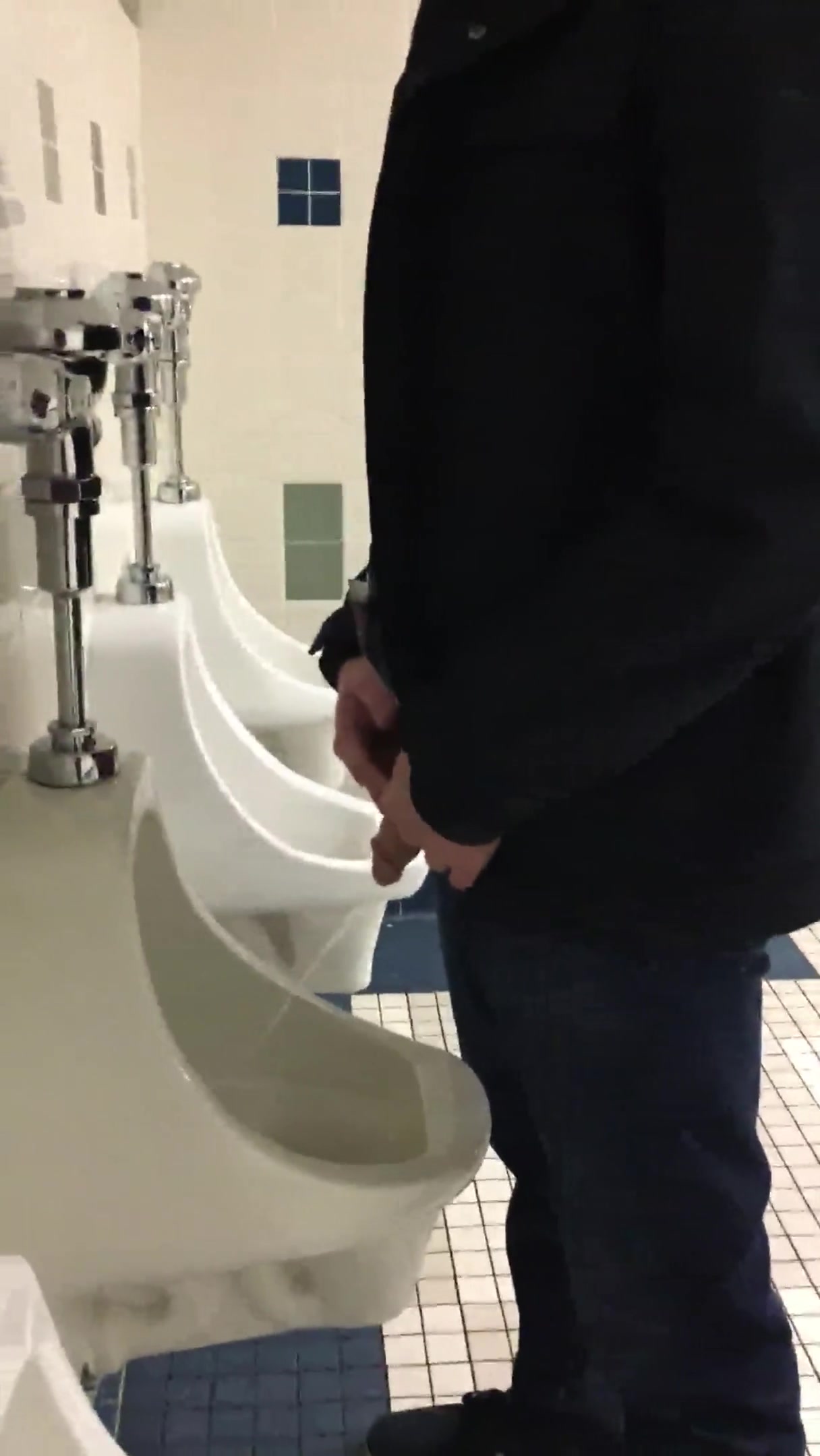 tall guy at urinal