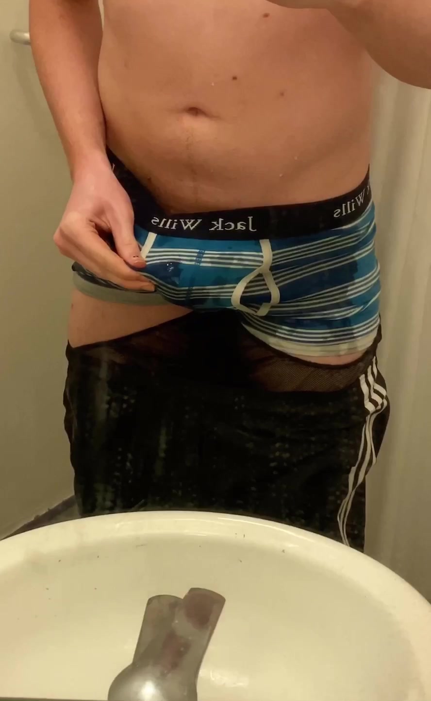 cute Twink pisses his Adidas shorts