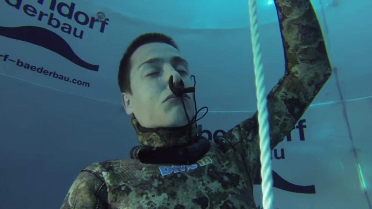 Barefaced freediver's deep underwater breathold