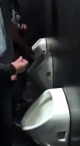 Guys Jerking off Together at Urinals