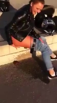 Drunk girl pissing and shitting on the street