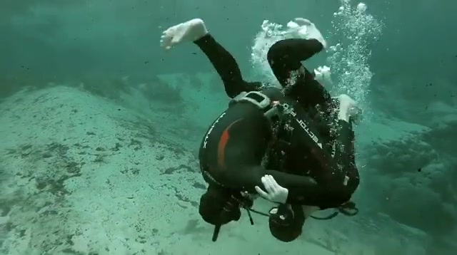 Scubadivers fighting underwater