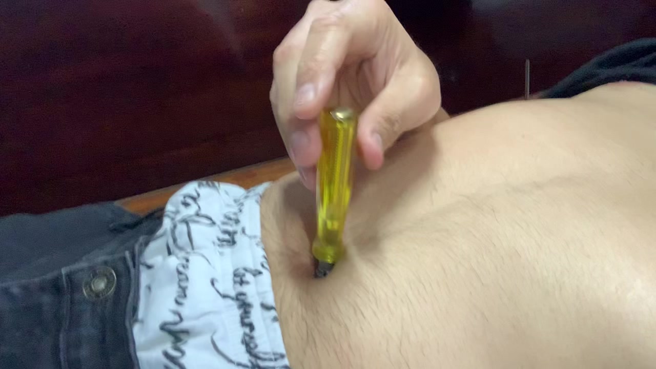 stab navel with screwdriver