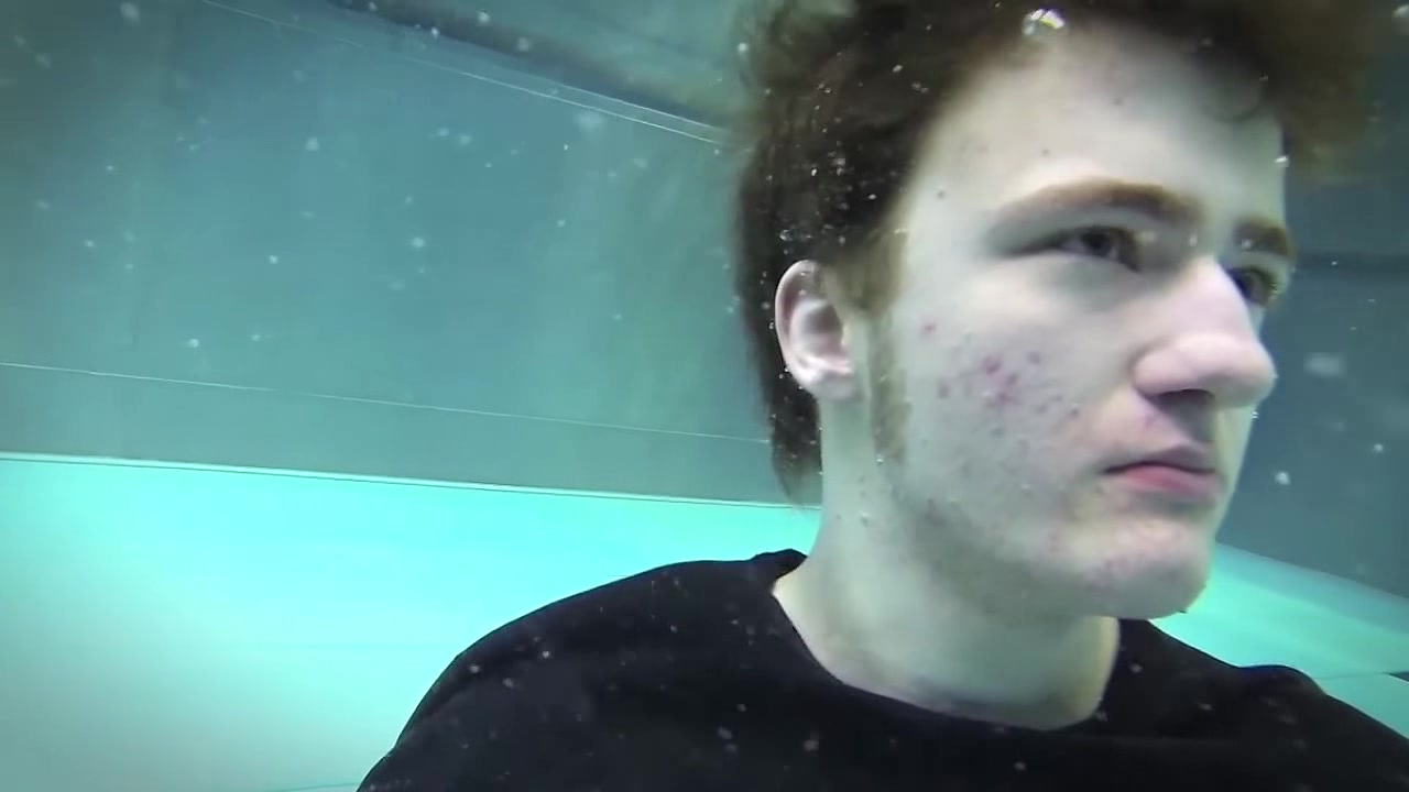Underwater barefaced guy in pool