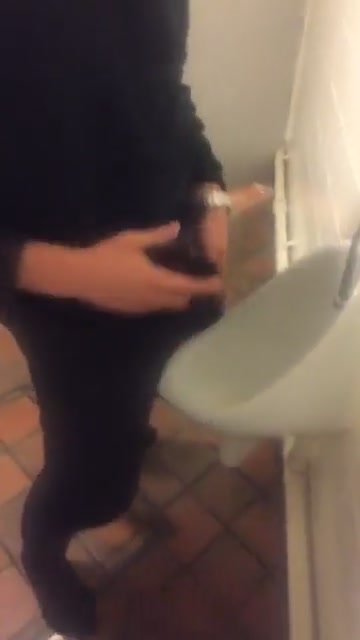 Mate pissing in the pub