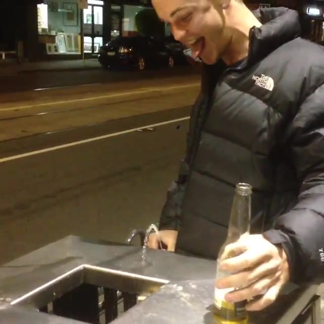 Drunk Aussie lad pissing in a bin