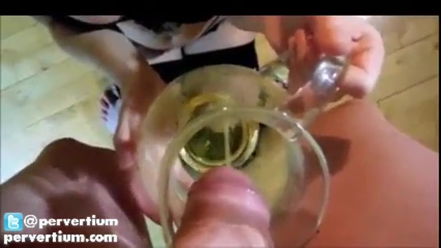 Drinking piss from a beer mug