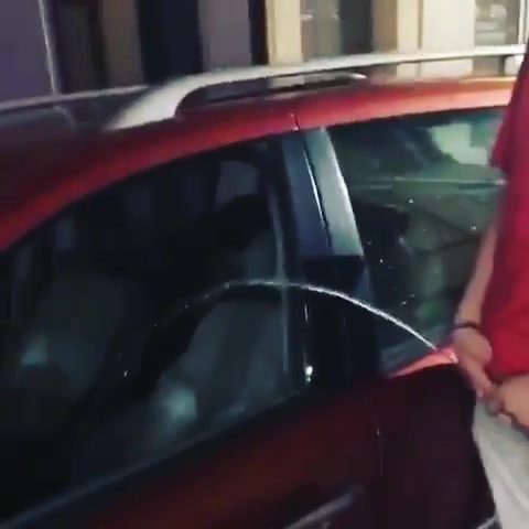 Drunk French lad pissing in someone's car